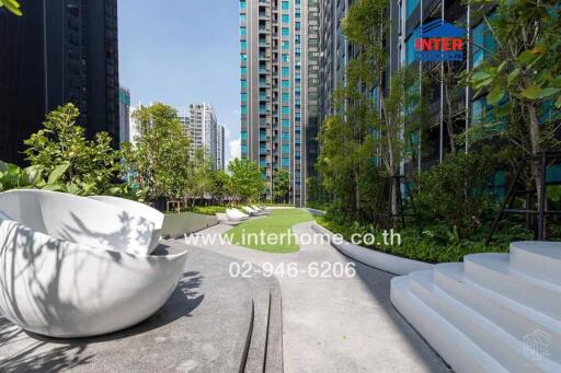 Modern high-rise residential buildings with landscaped outdoor area