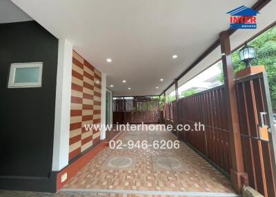 Covered carport with decorative tiles and lighting