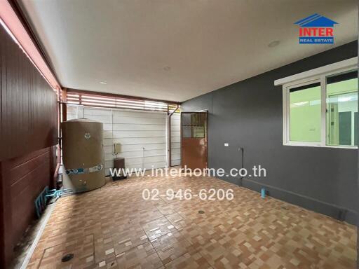 Covered patio area with water tank