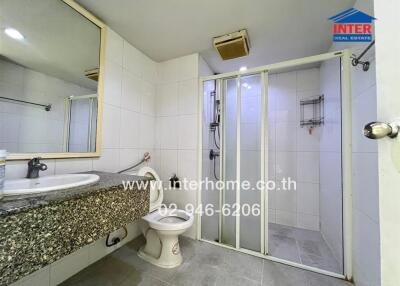 Bathroom with glass-enclosed shower