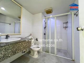Bathroom with glass-enclosed shower