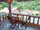 Balcony with a view and wooden furniture