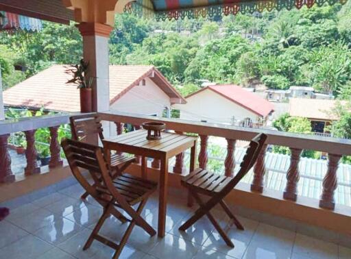 Balcony with a view and wooden furniture