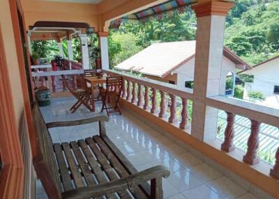 Spacious balcony with seating and scenic view