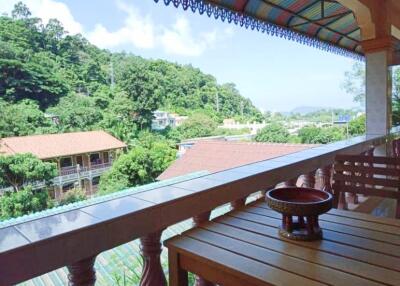 balcony with outdoor seating and scenic view