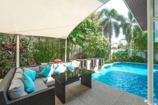 Outdoor patio with seating area and swimming pool