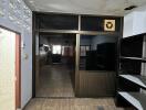 Empty room with wooden flooring and glass door