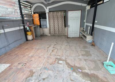 Outdoor covered space with tiled floor