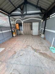 Outdoor covered space with tiled floor