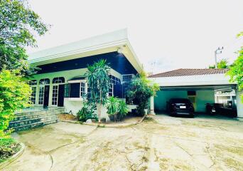 Front view of the house with a carport