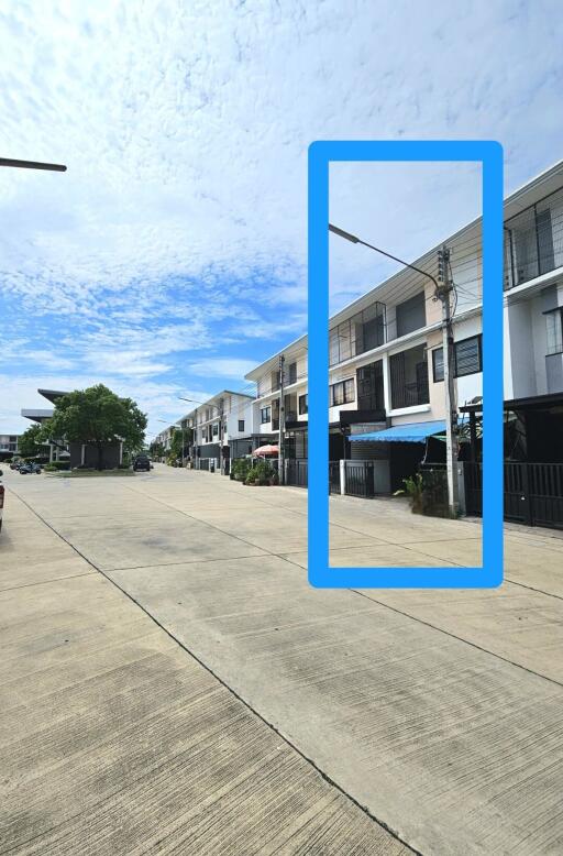 Street view of a townhouse in a residential area