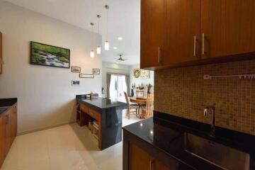 Modern kitchen with island and adjacent dining area