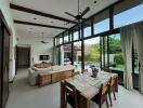 Spacious living and dining area with pool view