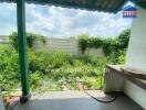 Outdoor garden with greenery and fence