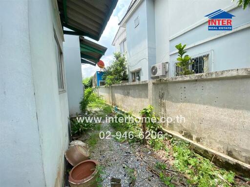 Exterior side alley with garden