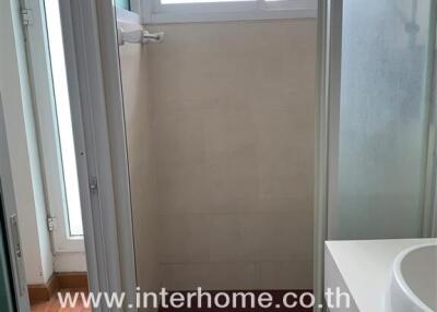 Compact bathroom with shower and sink