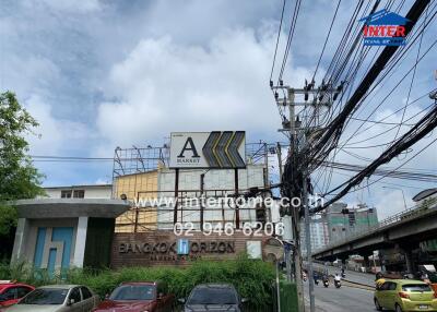 View of Bangkok Horizon building with A-Market billboard