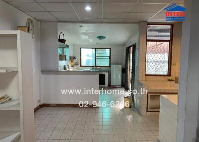 Kitchen and dining area with tiled floors and modern amenities