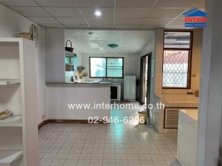 Kitchen and dining area with tiled floors and modern amenities