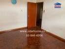 Empty room with wooden floor and door