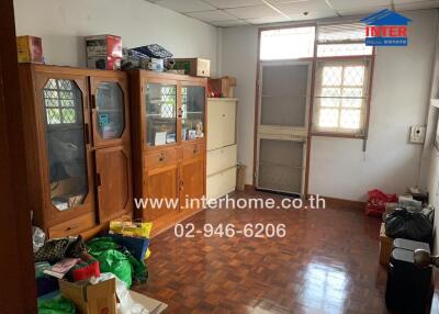 Room with wooden cabinets and miscellaneous items