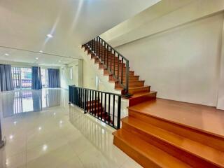 Spacious living room with staircase