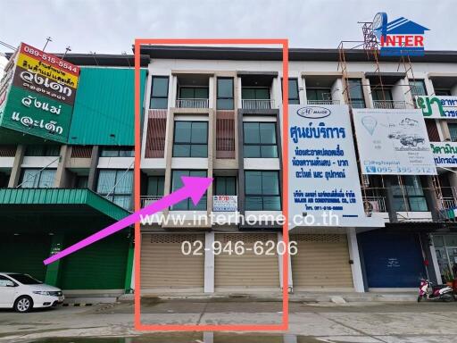 Exterior view of a commercial building with signage