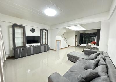 Spacious modern living room with sectional sofa and entertainment unit