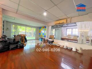 Spacious living room with large windows and garden view