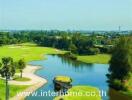 Landscape view of a golf course with water bodies and greenery