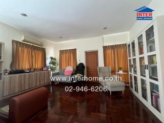 Living room with wooden floors and ample natural light