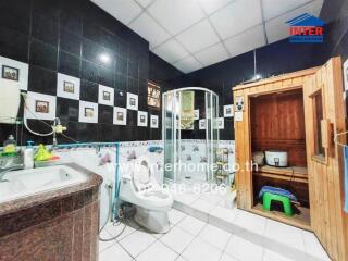 Bathroom with shower, sink, and toilet