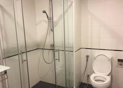 Modern bathroom with a glass shower and toilet
