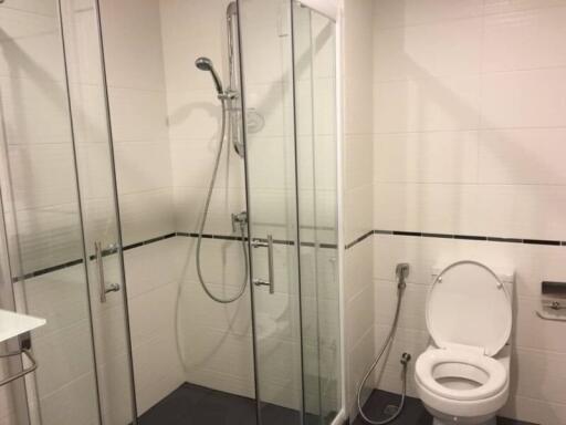 Modern bathroom with a glass shower and toilet