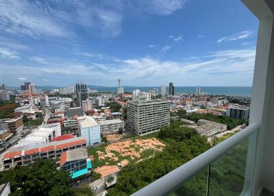 View from balcony overlooking city and ocean