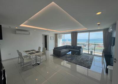 Modern living room with dining area and ocean view