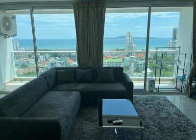 Living room with a view of the city and ocean
