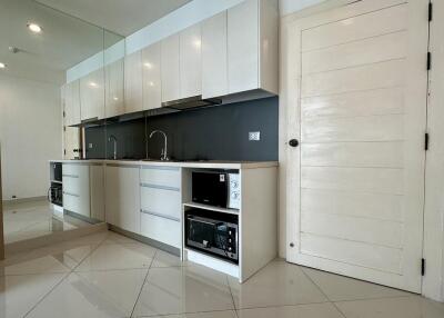 Modern kitchen with white cabinetry and appliances