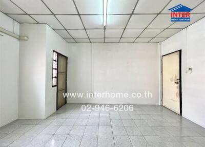 Empty room in building with tiled floor