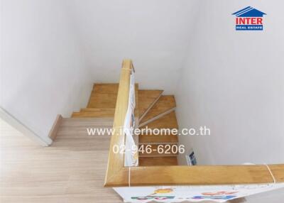 Wooden staircase with handrail