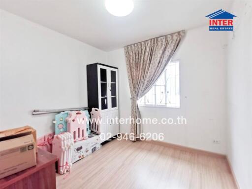 Bedroom with toys and cabinets