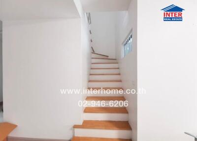 Staircase in a property with wooden steps