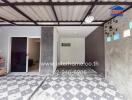 Covered carport with tiled floor and partially open walls