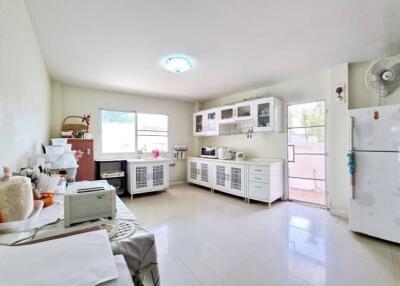 Spacious kitchen with modern appliances and ample storage