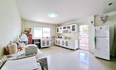 Spacious kitchen with modern appliances and ample storage