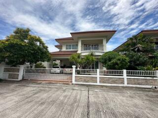 Two-story house with a front yard and a driveway