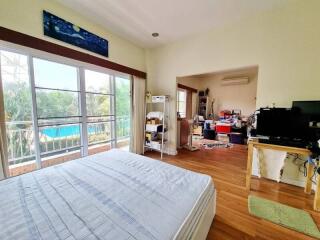 Spacious bedroom with balcony and view