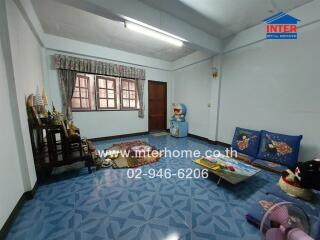 Spacious living room with blue tiles and decorations