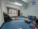 Spacious living room with blue tiles and decorations