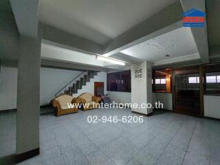 Living room with seating area and staircase